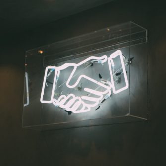 Neon sign handshake